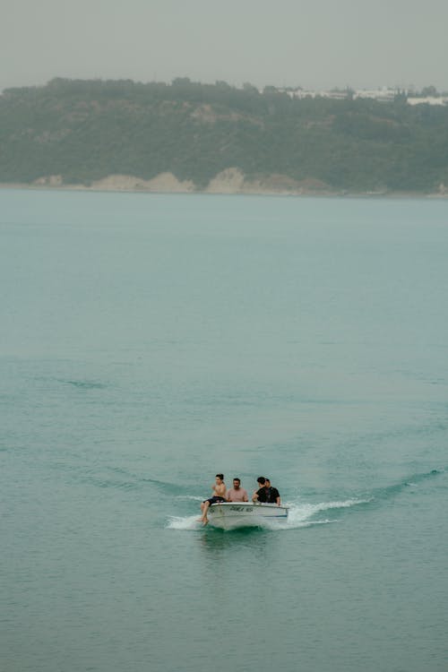 A group of people riding in a boat on the water
