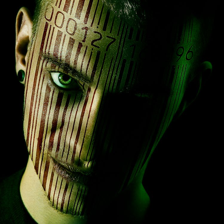 Free Man with Barcode Printed on his Face Stock Photo