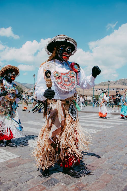 Dancers in Traditional Costumes and Masks Celebrating in Peru 
