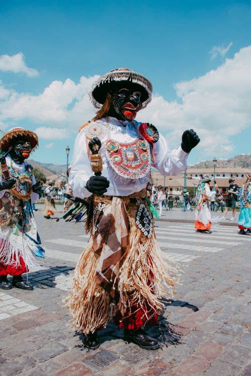 Free Colorful traditional festival with dancers in elaborate costumes celebrating Peruvian culture in Cusco. Stock Photo