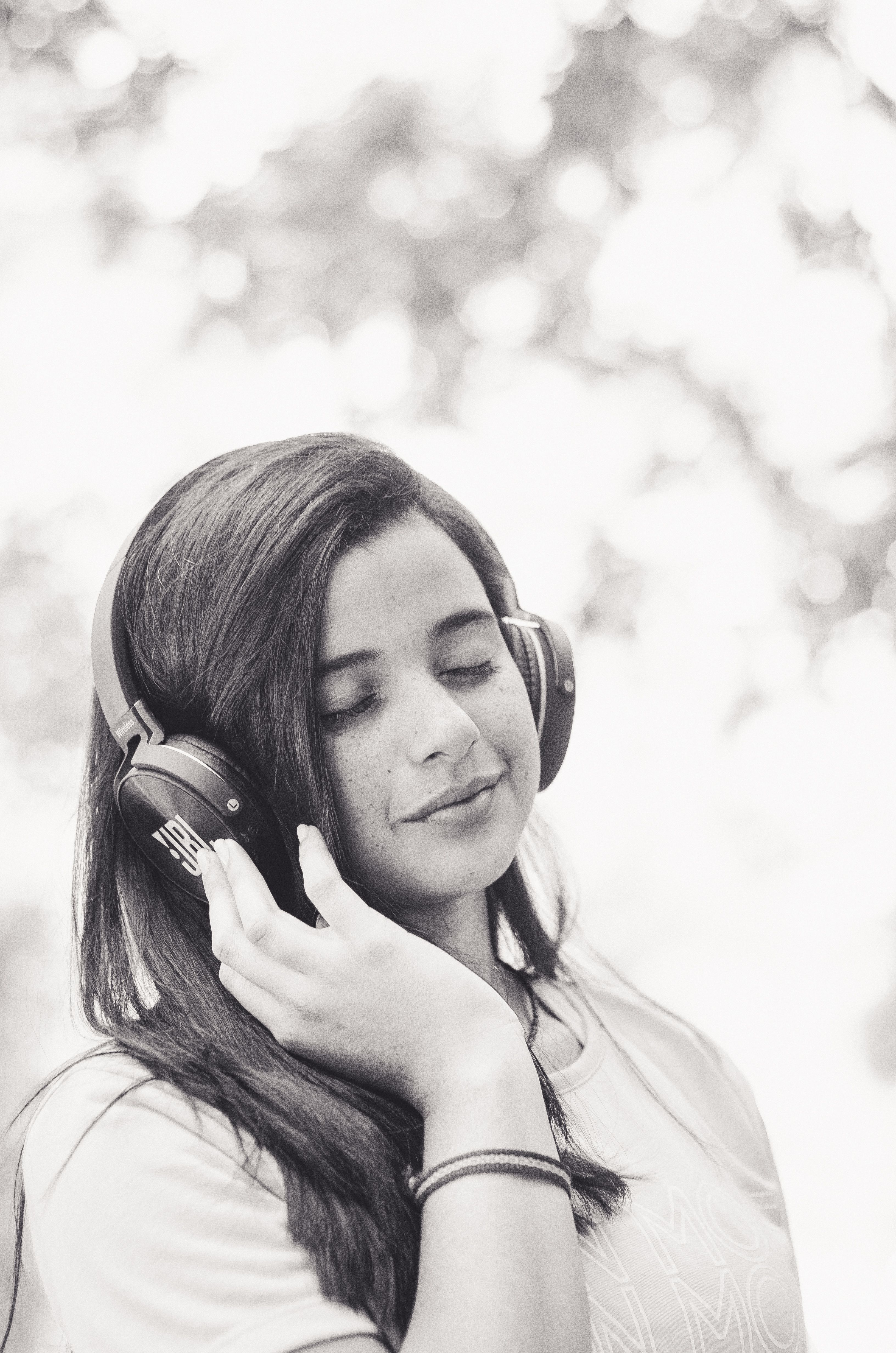 Portrait of Brunette Woman in Park in Black and White · Free Stock Photo