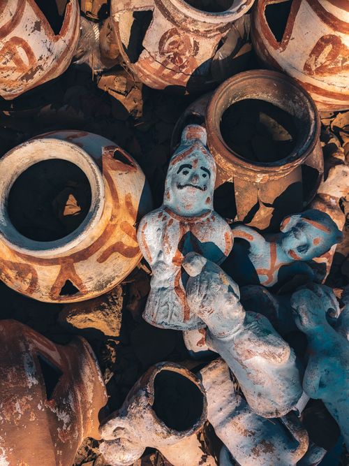 Free Assorted rustic pottery and sculptures basking in sunlight, highlighting traditional craftsmanship. Stock Photo