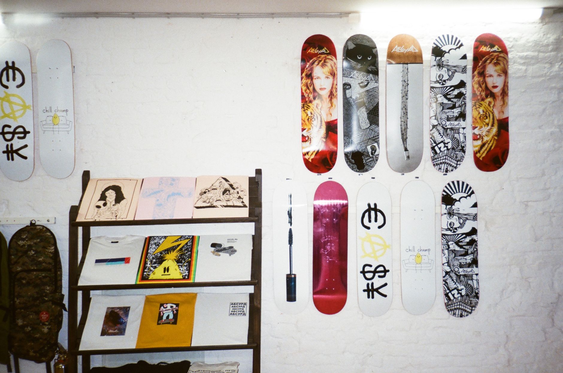 Vintage skateboard deck artwork photographed on a concrete Houston ramp under late afternoon light