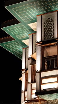 Stunning view of a modern building with intricate designs in Konya, Türkiye, illuminated at night. - Fotografer Sidoarjo