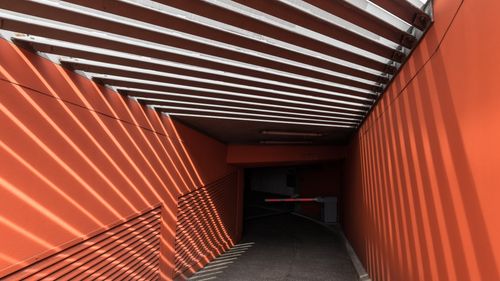 Free Vivid orange and white shadows in an urban underground tunnel in Hamburg. Stock Photo