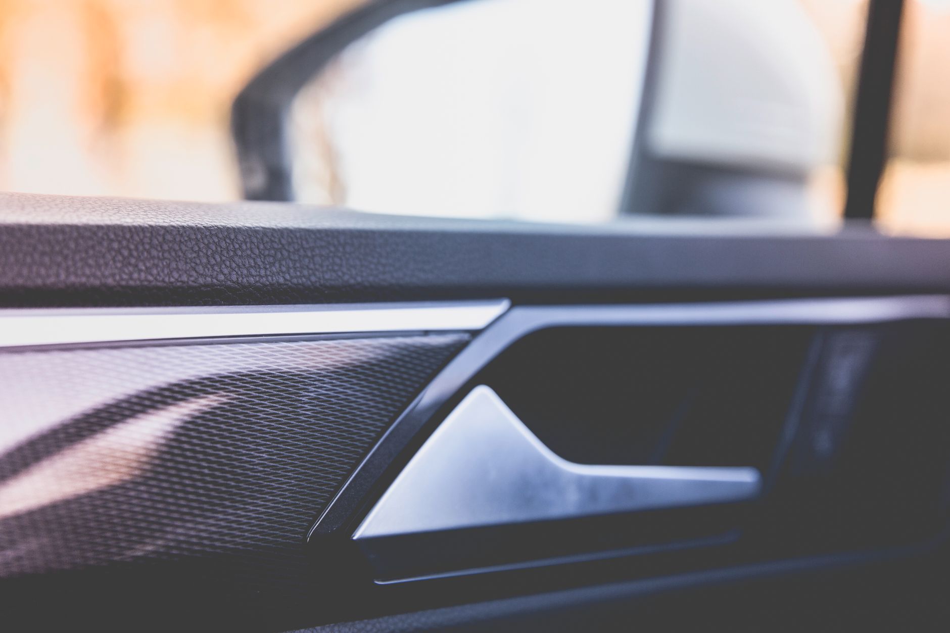 Detailed view of a car door interior panel showing texture and design elements.