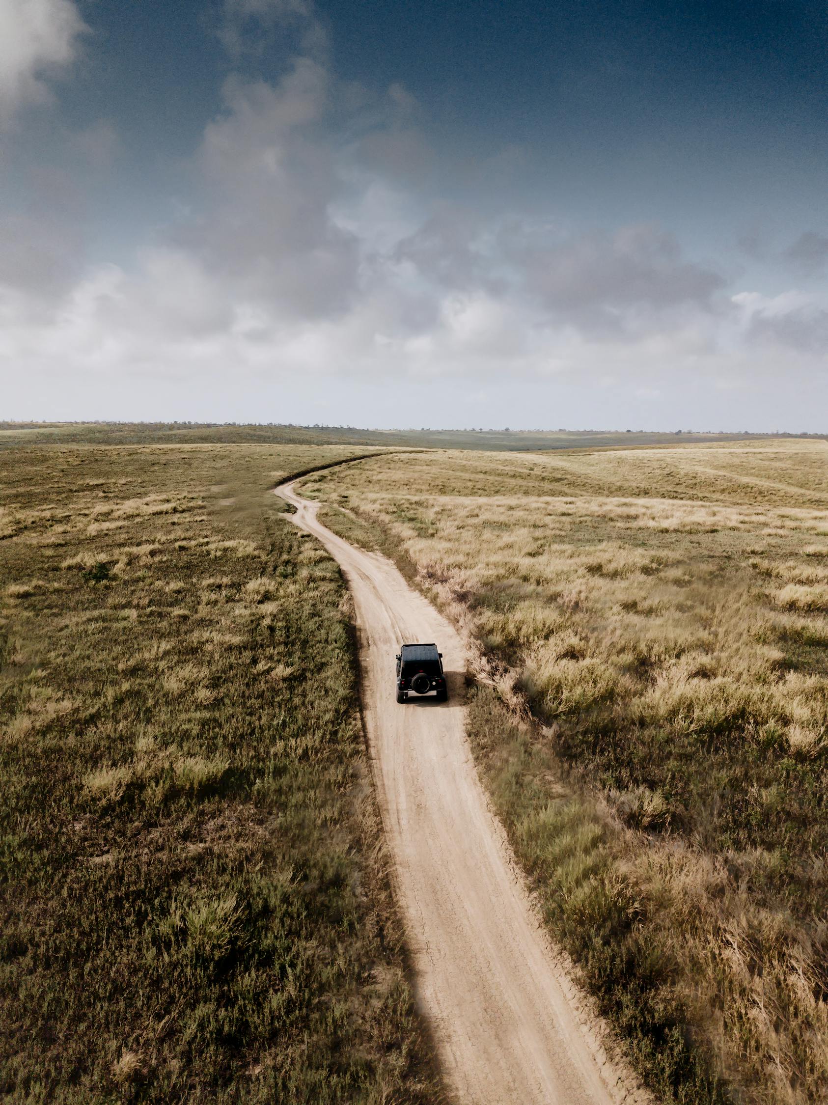 Photo of Vehicle on Dirt Road