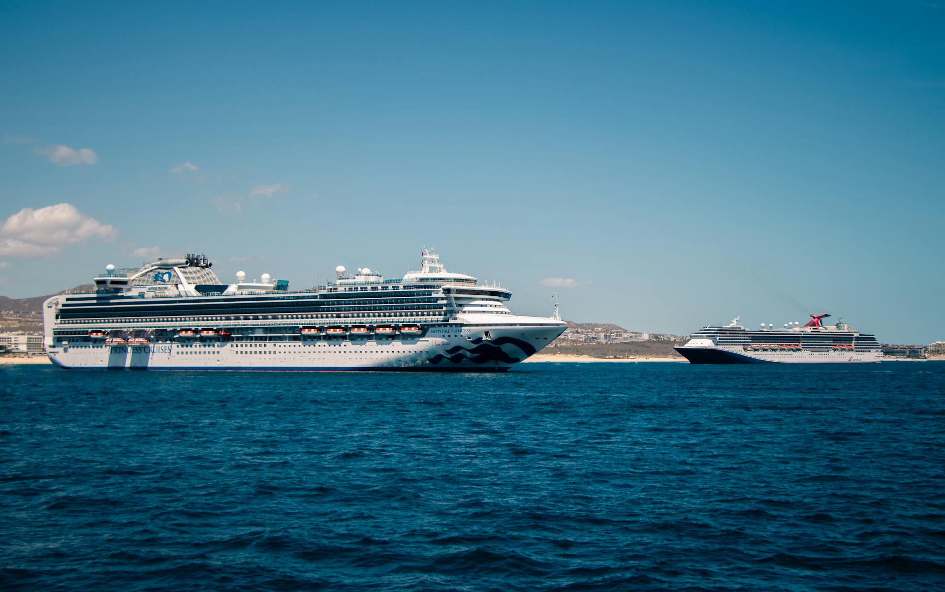 Two cruise ships anchored near the beautiful coast of Cabo San Lucas, México.