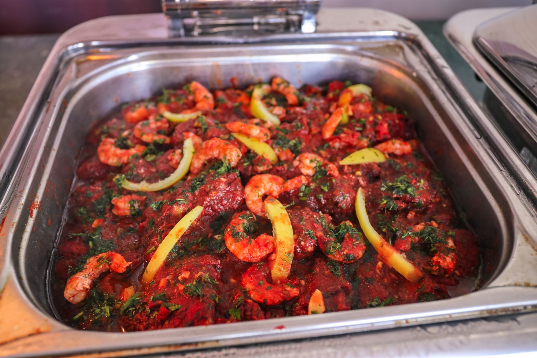 Mouth-watering prawn dish with bell peppers in a rich tomato sauce. Perfect for seafood lovers.
