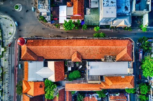 Free Aerial view of red-roofed buildings and street in Jakarta, Indonesia. Stock Photo