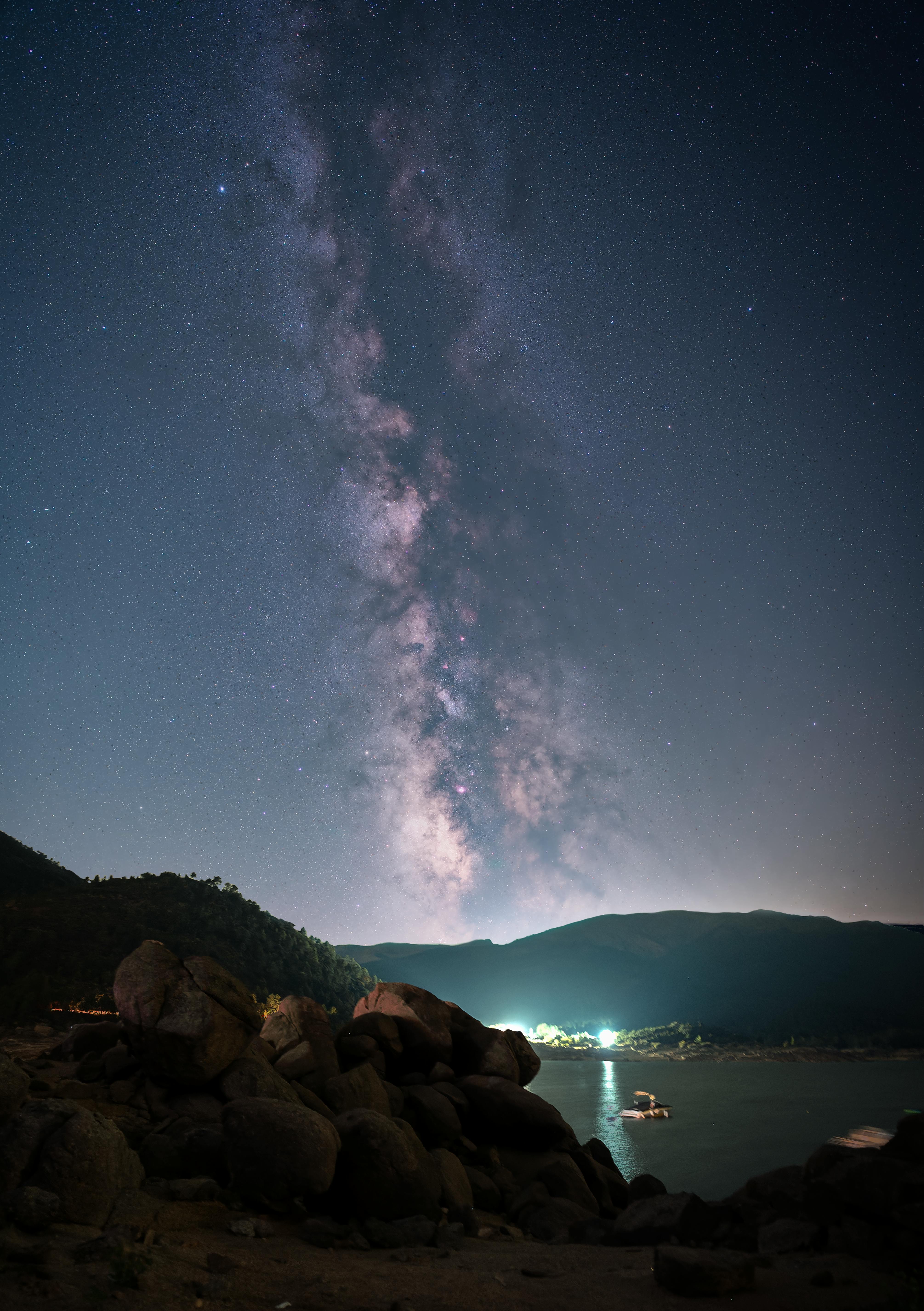 Captivating view of the Milky Way galaxy over a serene night landscape in Madrid, Spain.