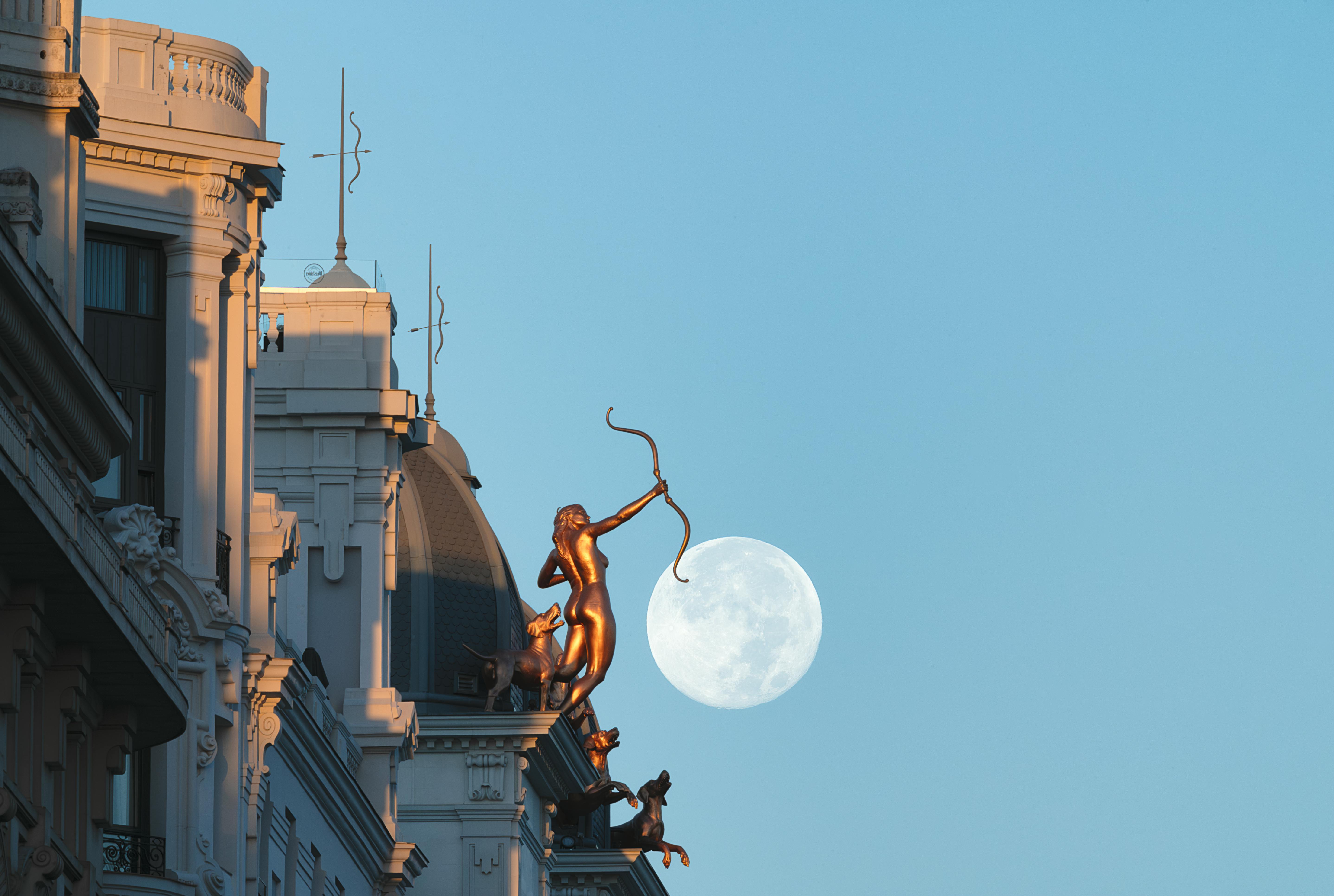 monument on a tenement in madrid during sunset