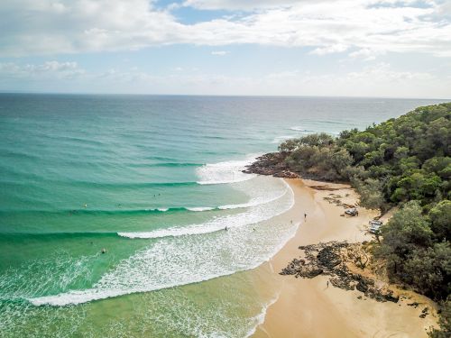 Free Discover the scenic beauty of Rainbow Beach, QLD with waves crashing on the pristine shore. Stock Photo
