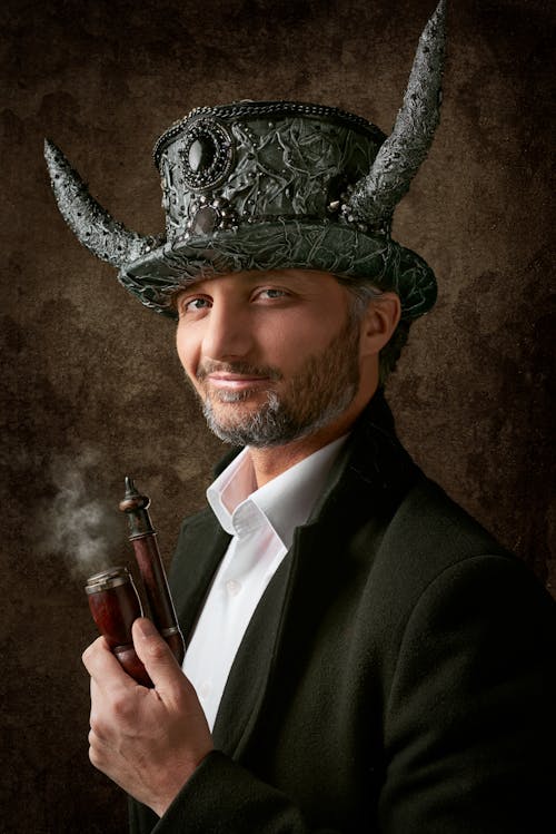 Man Smiling Wearing Hat with Horns