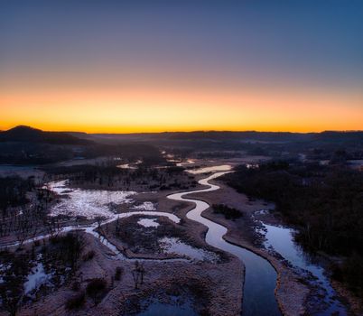 A stunning aerial view capturing the serene wetlands at sunset in Tell, Wisconsin, United States.