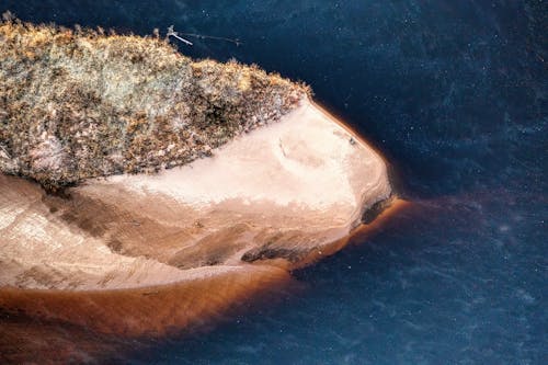 An aerial view of a small island in the water
