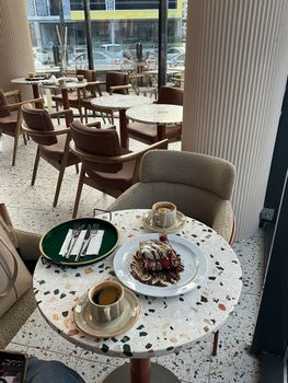 Inviting café scene with coffee and dessert ready for a delightful dining experience.