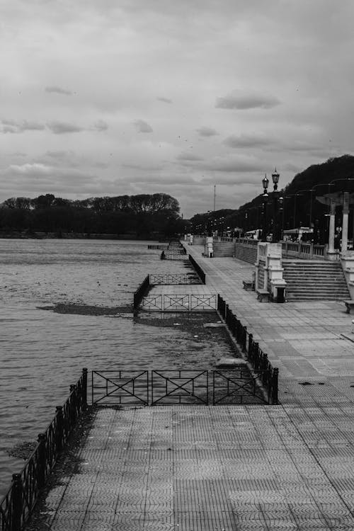 A black and white photo of a pier