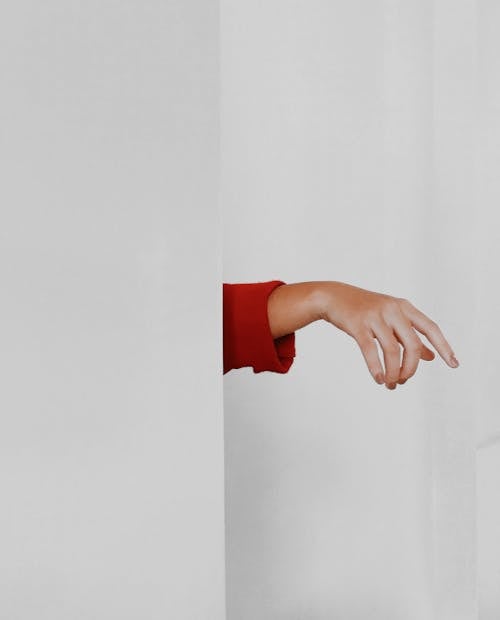 Free Right Human Hand Beside White Painted Wall Stock Photo