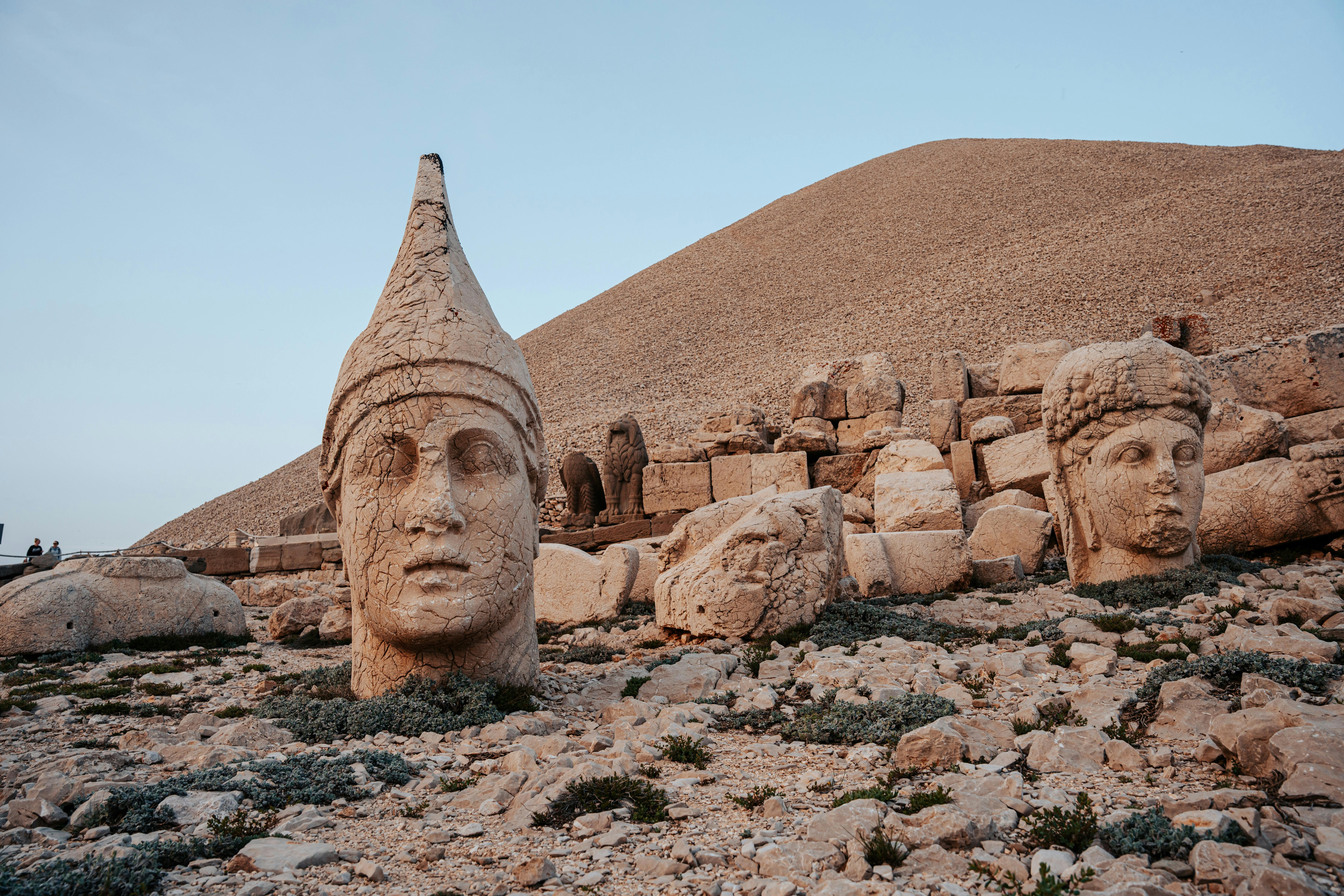 Majestic ancient sculptures at Mount Nemrut, a UNESCO site in Turkey, showcasing historical grandeur.