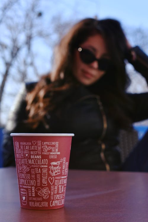 Free Red and White Cup on Wooden Table Stock Photo