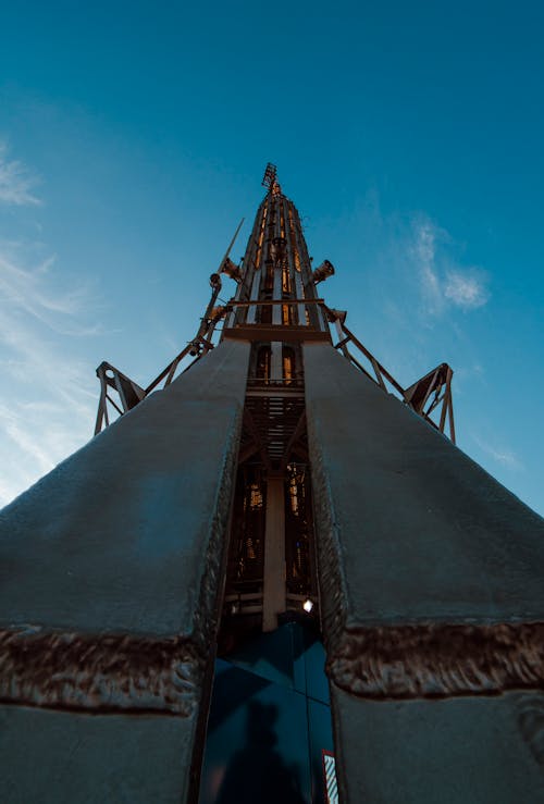 A tall metal tower with a blue sky in the background