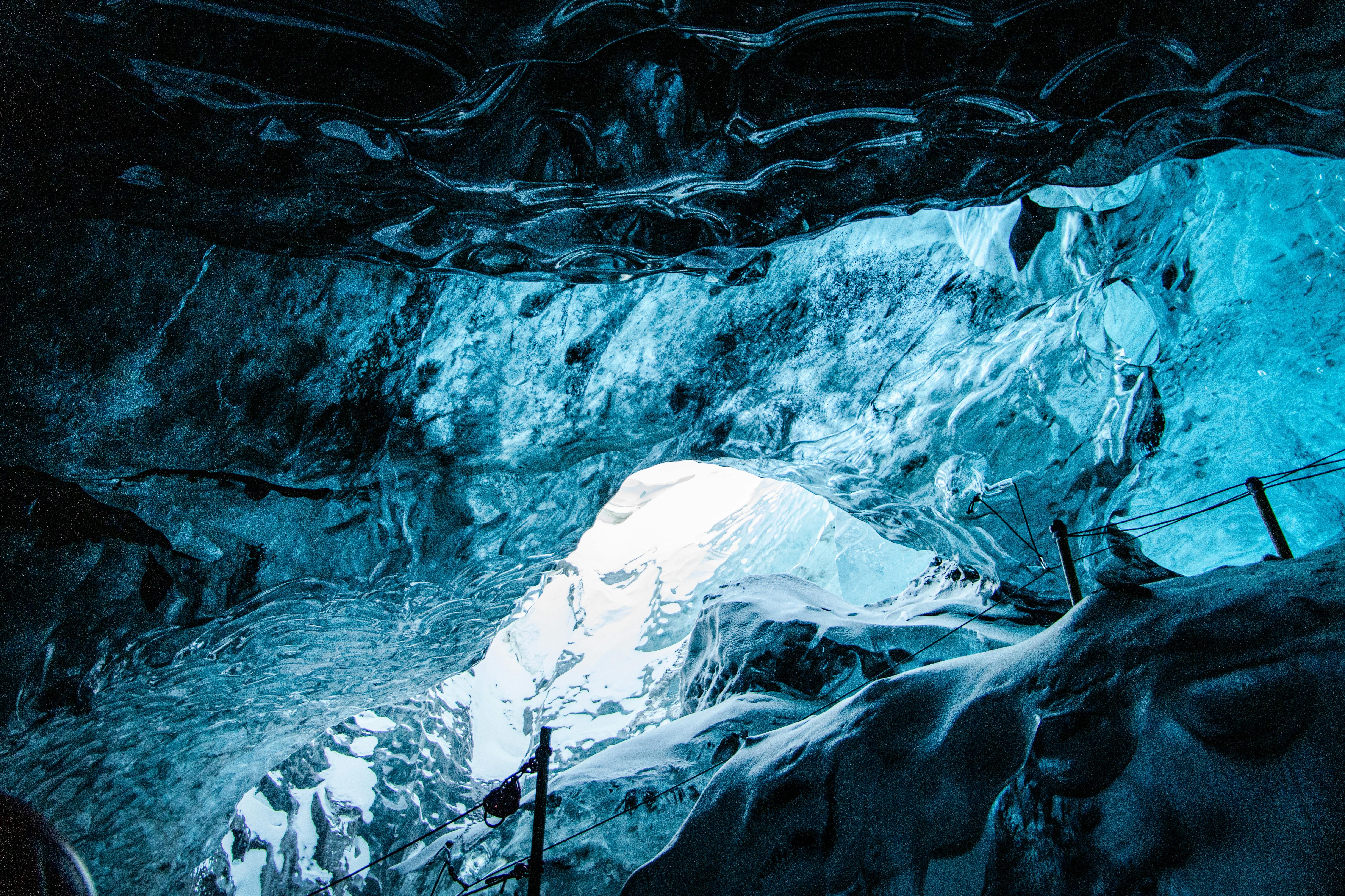 Explore the stunning interior of an Icelandic ice cave with mesmerizing blue hues and frozen textures.