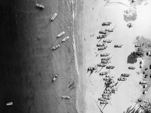 An aerial view of a beach with boats