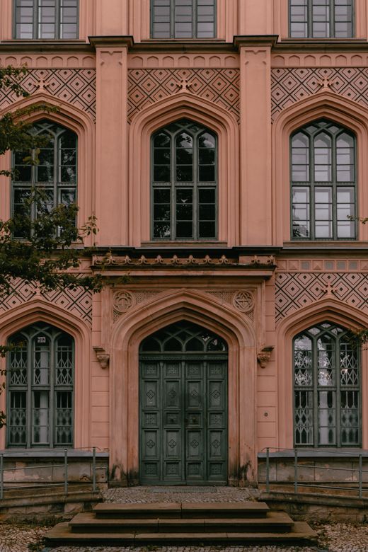 Ornate gothic revival facade at dusk — photo by Luca Dross on Pexels