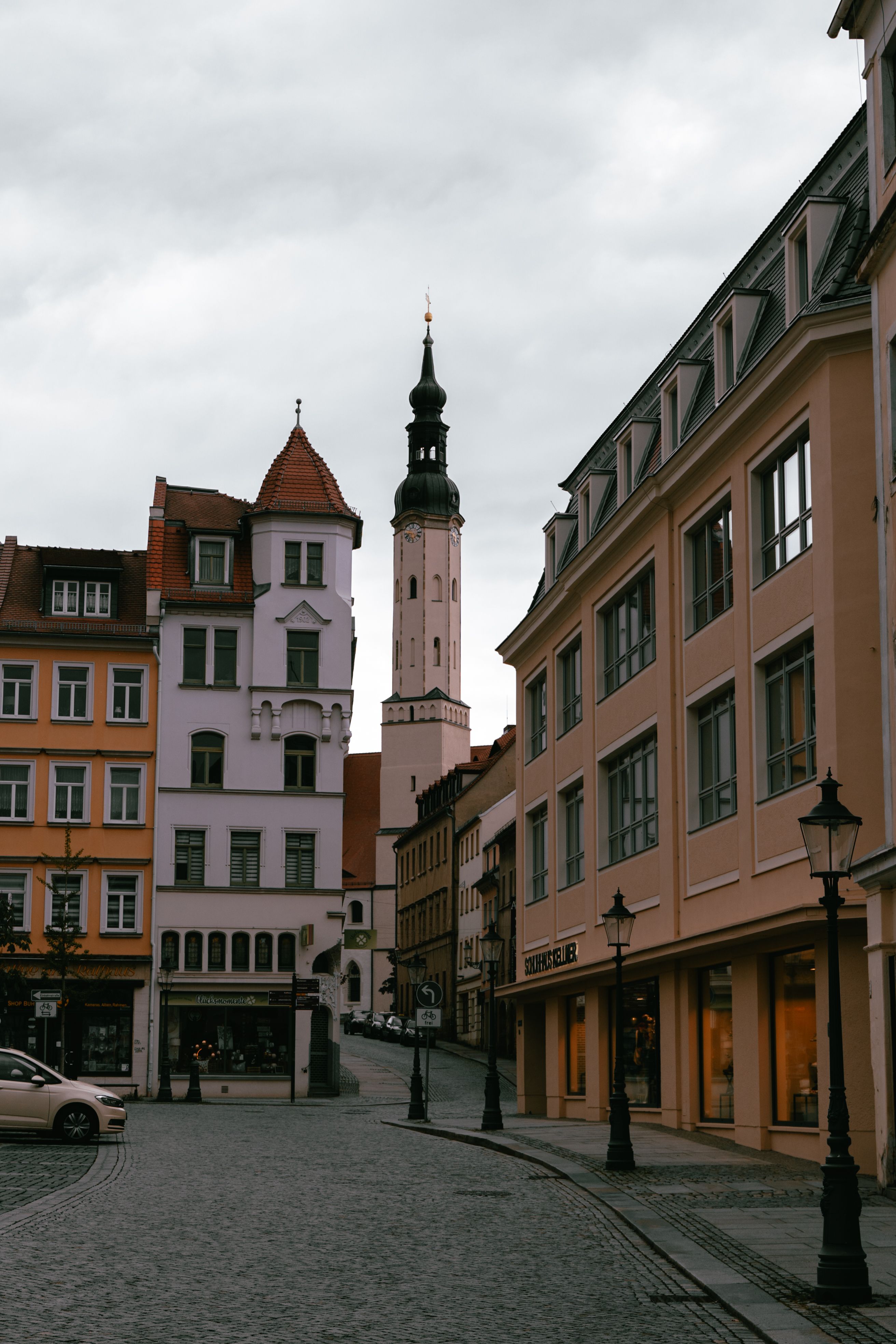 A street with buildings and a clock tower · Free Stock Photo