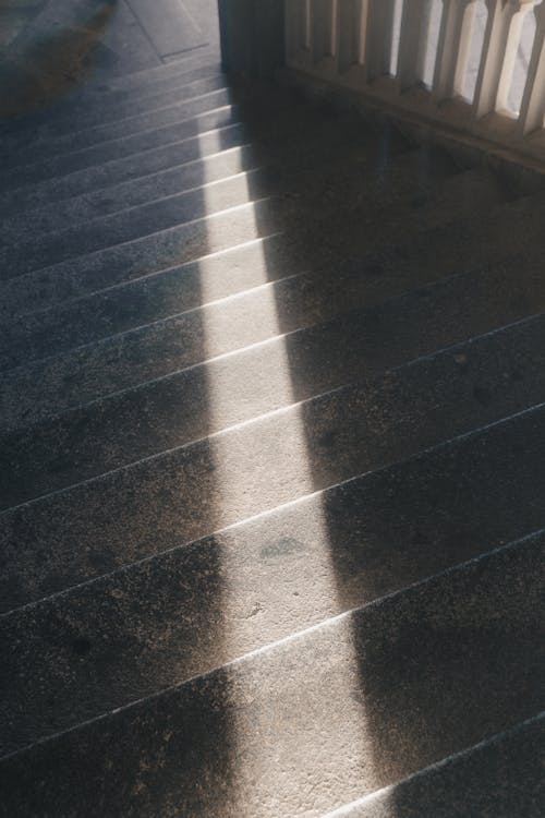 A photo of a stairway with the sun shining on it