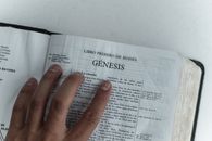 Photo of Person Holding a Bible