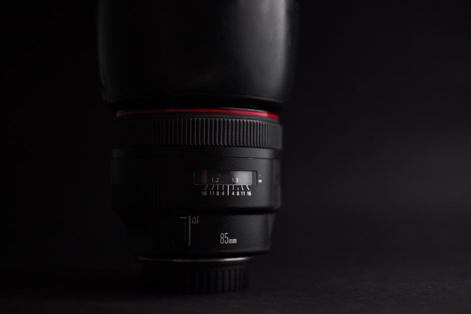 Detailed view of an 85mm camera lens with focus ring and aperture settings. - Synergistic Benefits with Other Supplements