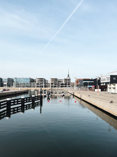 A view of a city with a dock and buildings