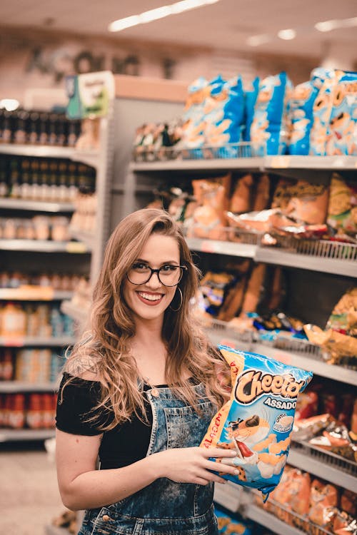 Free Woman Holding Chips Stock Photo