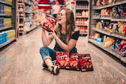 Free Woman Holding Bag Of Chips Stock Photo