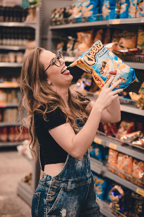 Free Woman Holding Chips Stock Photo