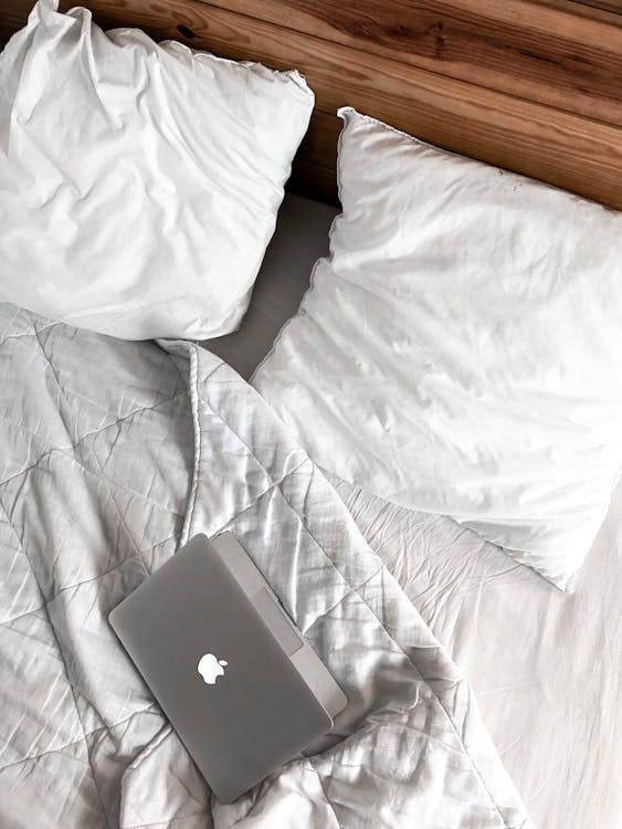 Macbook on a Messy Bed