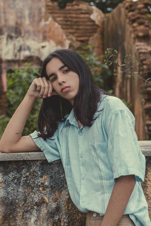 woman leaning on the wall