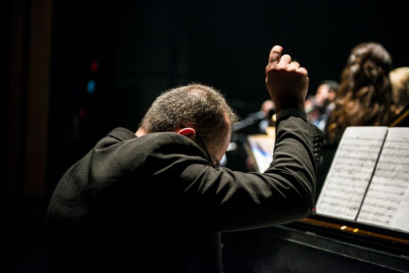 Conductor leading an orchestra — Jacob Yavin on Pexels