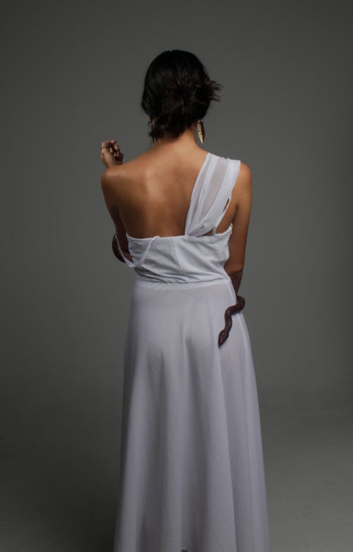 Photo of Woman Wearing One-Shoulder Dress