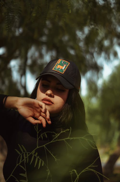 Photo of Woman Wearing Black Cap