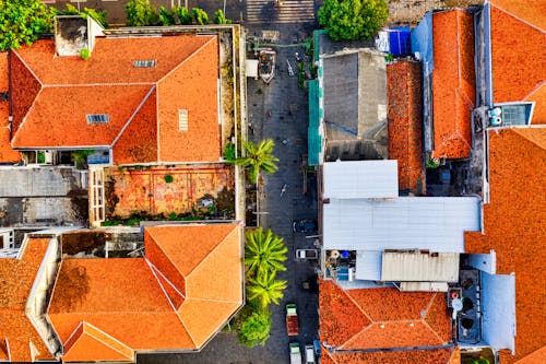 Bird's-eye View Photography of Two Orange RoofedHouses