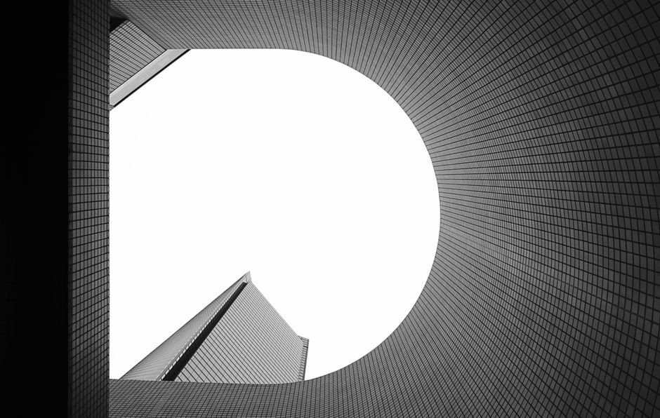 Dynamic shot of modern architecture with grid patterns in black and white.