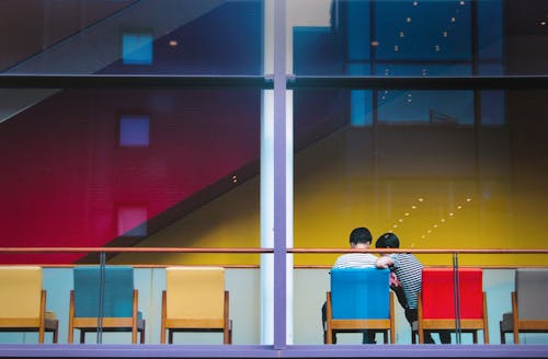 couple sitting on chairs