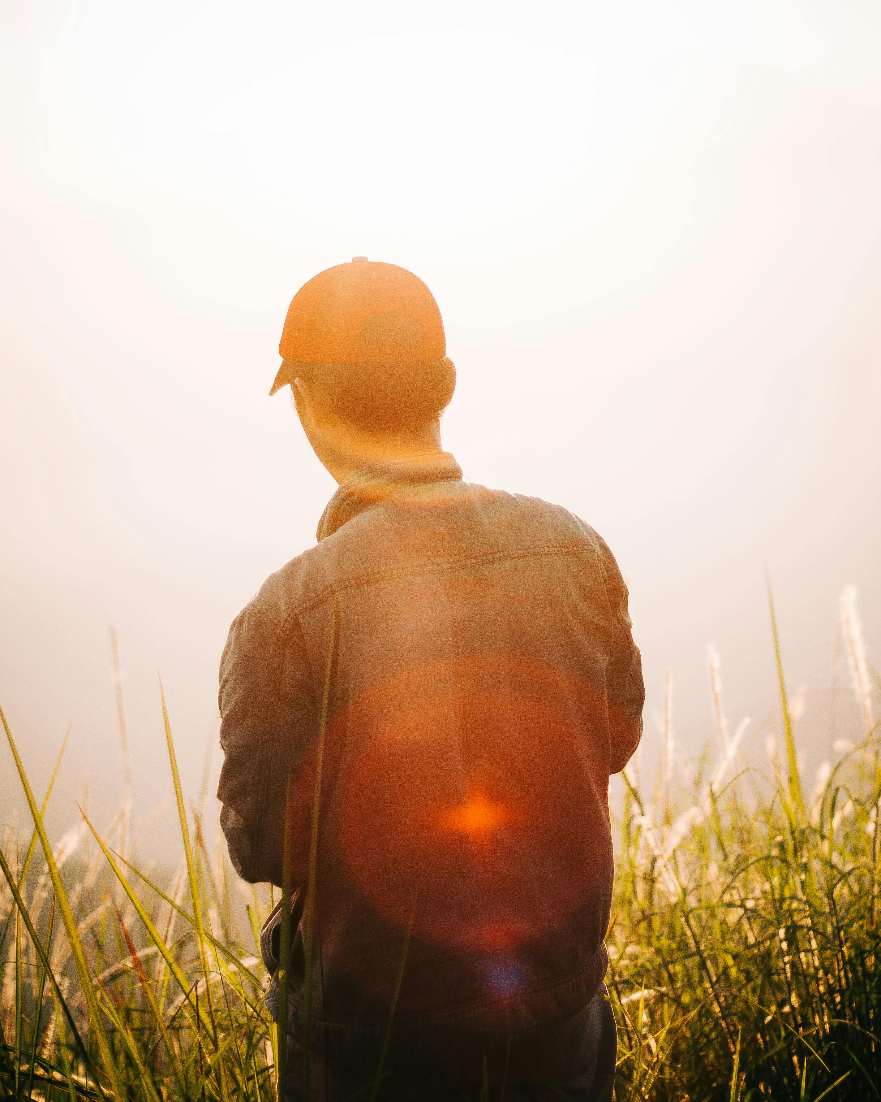 Man Standing On Mountain Top · Free Stock Photo