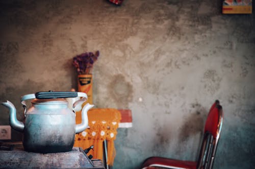 Kettle on Table Near Chair