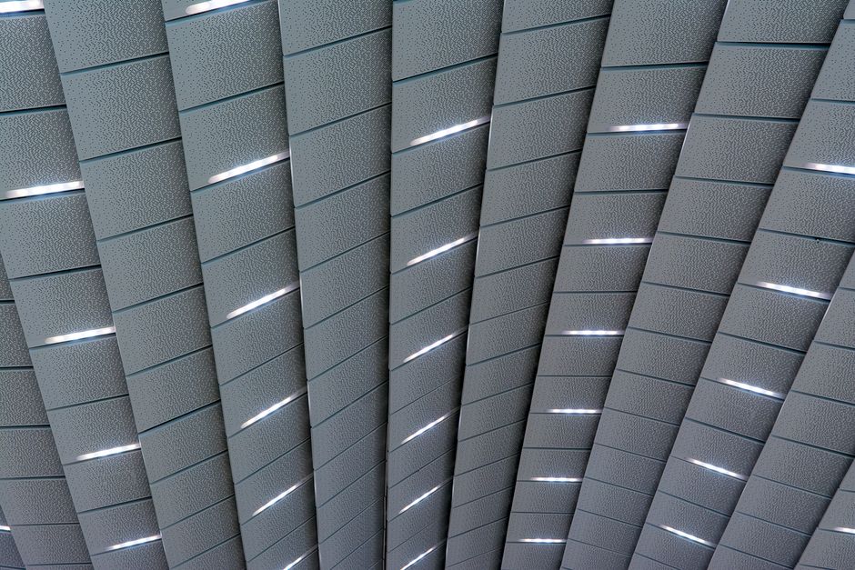 Futuristic and sleek modern ceiling design with unique lighting patterns.