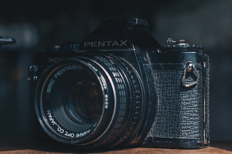 Black Pentax Camera In Selective Focus Photography