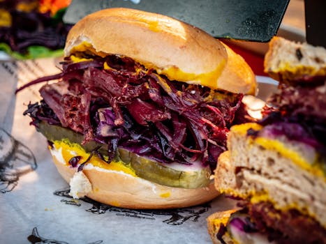 A juicy sandwich featuring fresh vegetables and flavorful meat, perfect for a tasty meal.